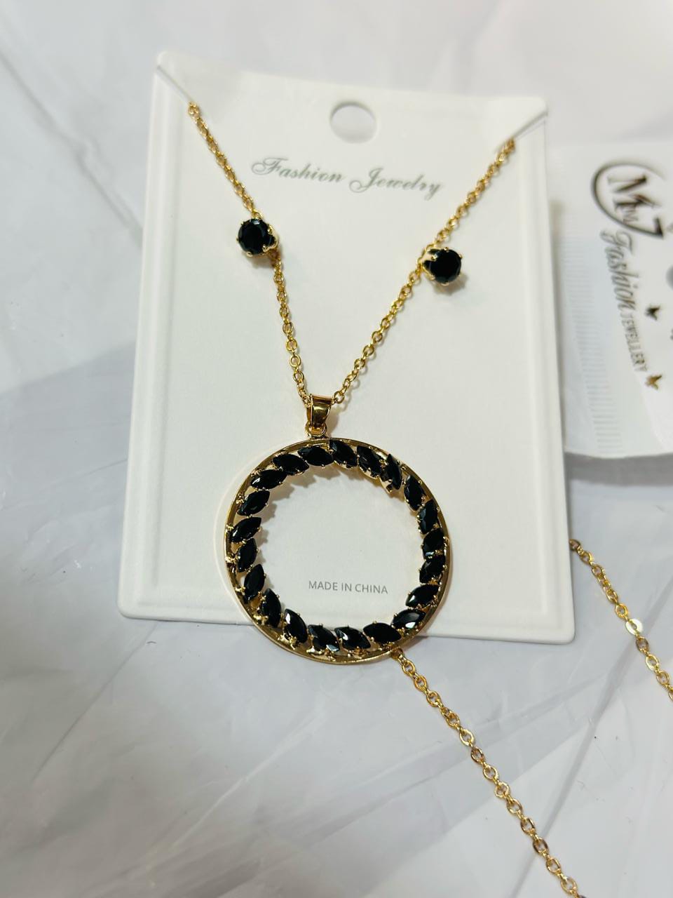 Black necklace with little earrings